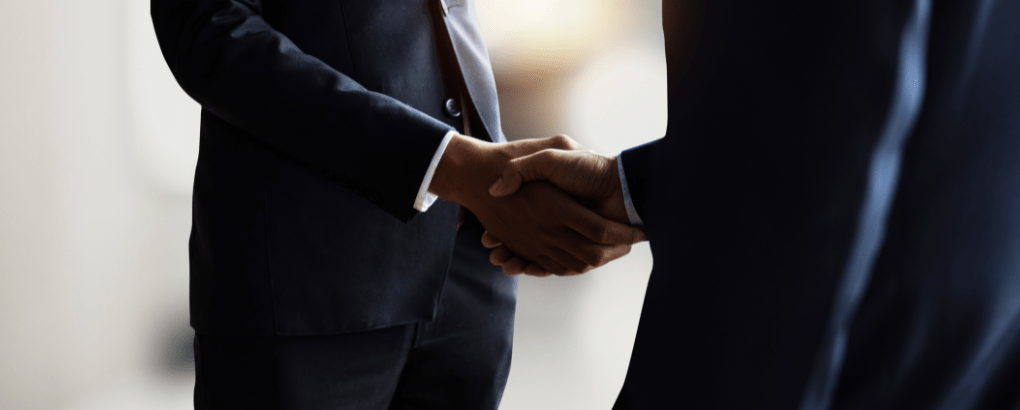 two businessman shaking hands