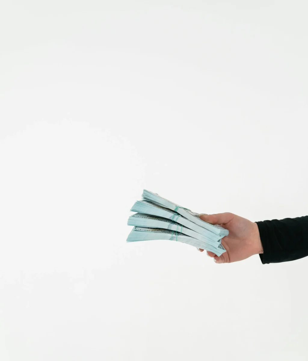 Man holding stacks of paper money